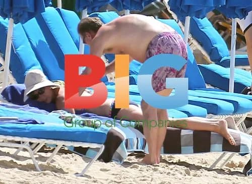 Glenn Hoddle on Caribbean beach with wife