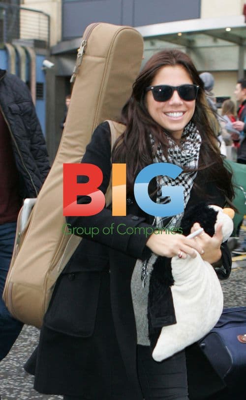 Christina Perri Leaves Hotel with Penguin Hot Water Bottle