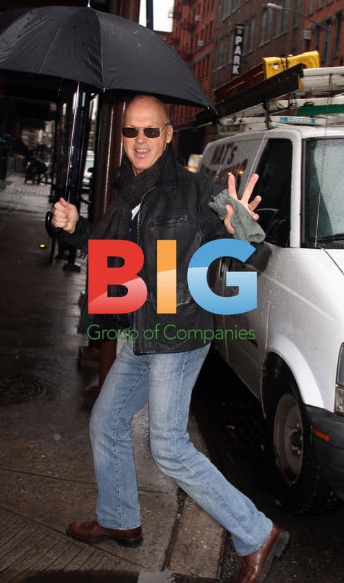 Michael Keaton walks in Soho rain
