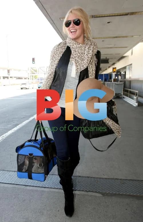 Kate Upton Arrives at LAX with Dog