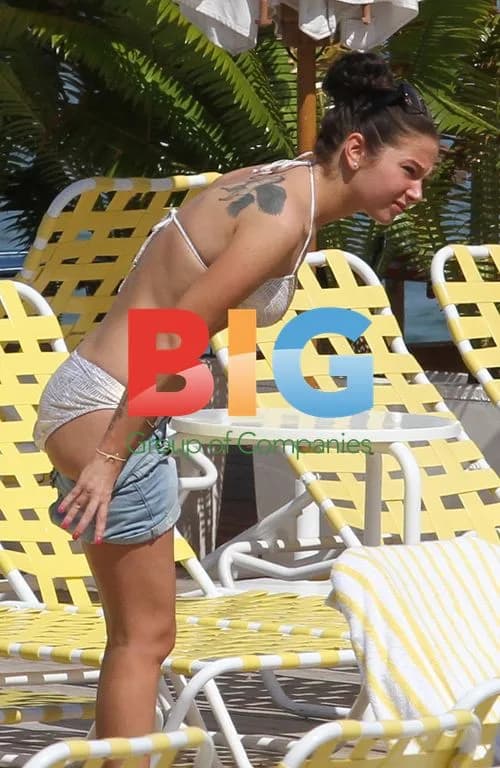 Tulisa Contostavlos Relaxes by Hotel Pool