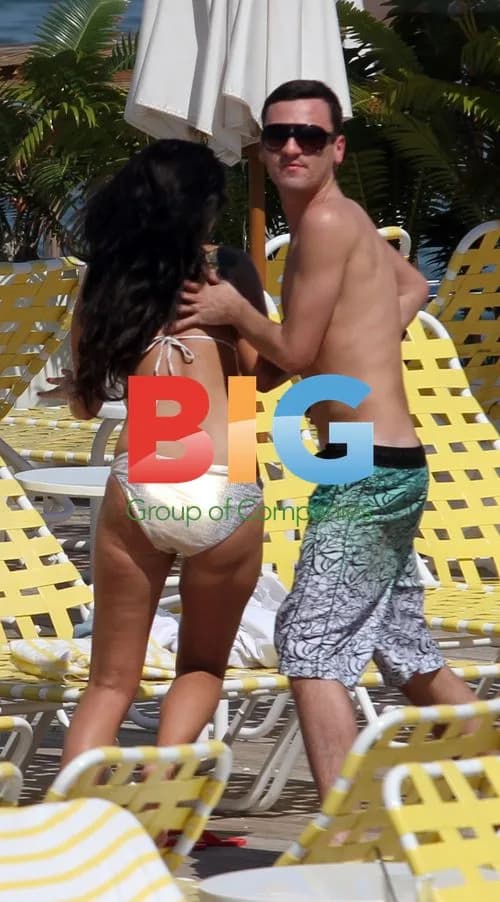 Tulisa Contostavlos relaxing by hotel pool in Miami