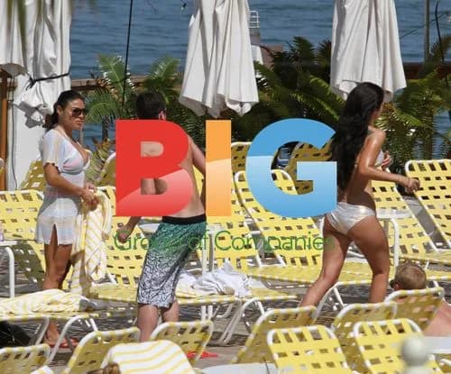 Tulisa Contostavlos relaxes by Miami hotel pool