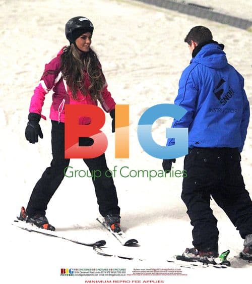 Katie Price tumbles during skiing lesson