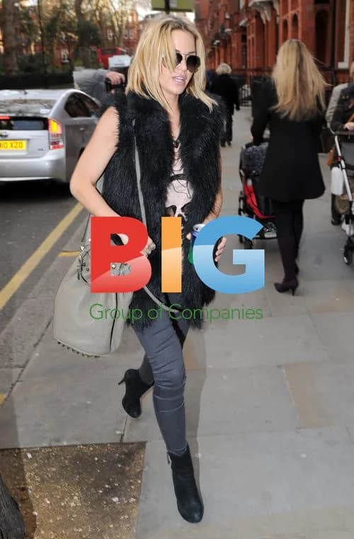 Singer Sarah Harding Heads to Office in London