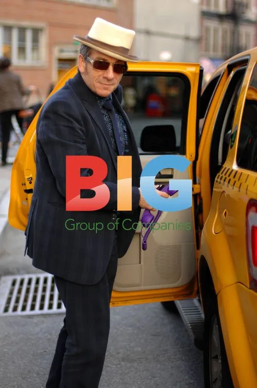 Elvis Costello jumps into cab with phone