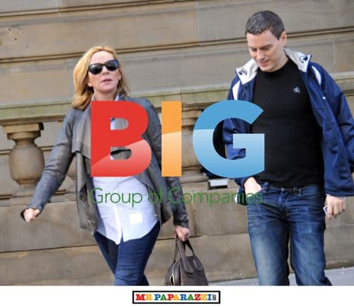 Kim Cattrall leaves hotel with mystery man