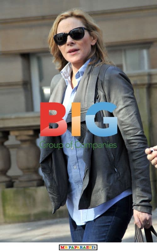 Kim Cattrall Leaves Hotel with Mystery Man