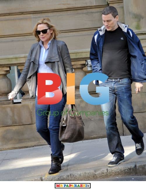 Kim Cattrall Leaves Hotel with Mystery Man