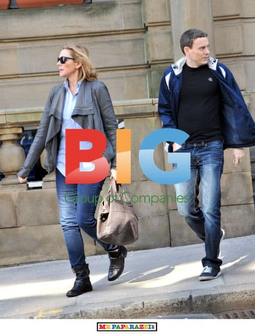 Kim Cattrall Leaves Hotel with Mystery Man