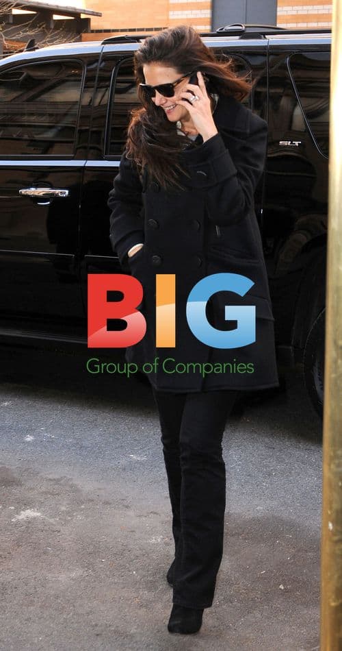 Katie Holmes Arrives Home on Windy Day