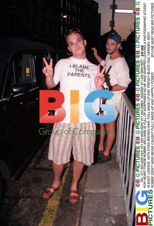 Robbie Williams Leaves Studio with Unusual Look