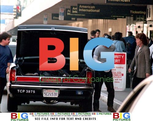 Brad Pitt Hides from Fans at LAX
