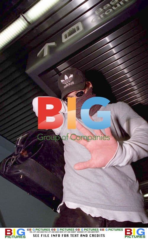 Brad Pitt Hides from Fans at LA Airport