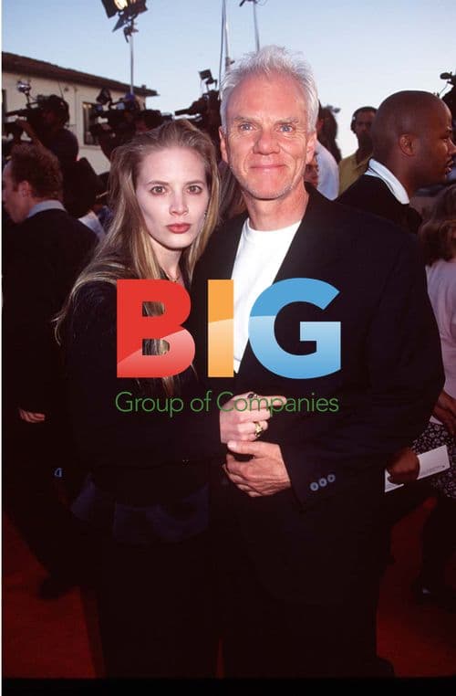 Malcolm McDowell and wife at "Twister" premiere