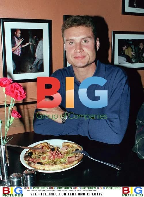F1 Driver David Coulthard Eating Pizza in London