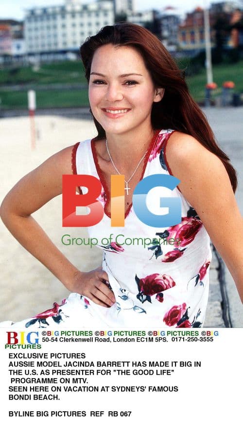 Jacinda Barrett walks Bondi Beach in Sydney