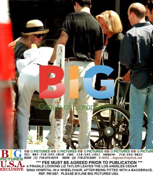 Elizabeth Taylor leaves hospital in wheelchair