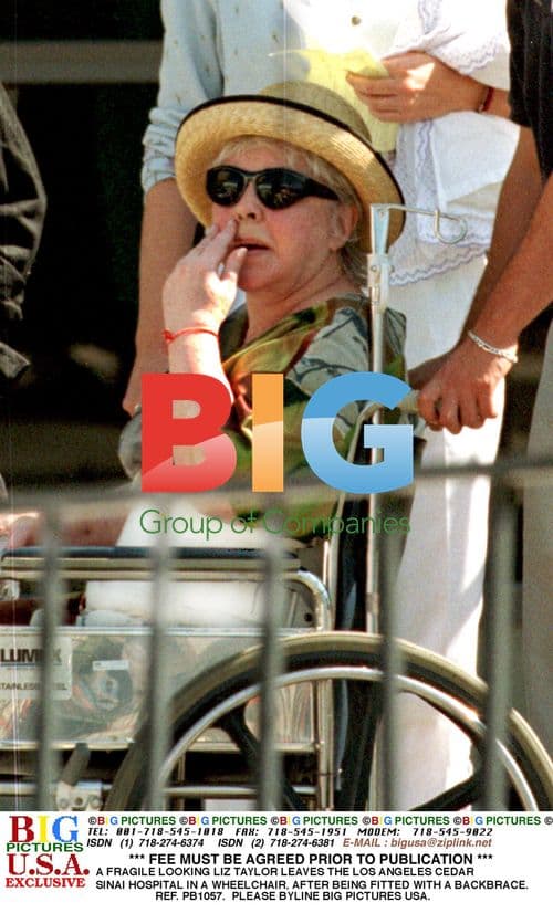 Elizabeth Taylor leaves hospital in wheelchair