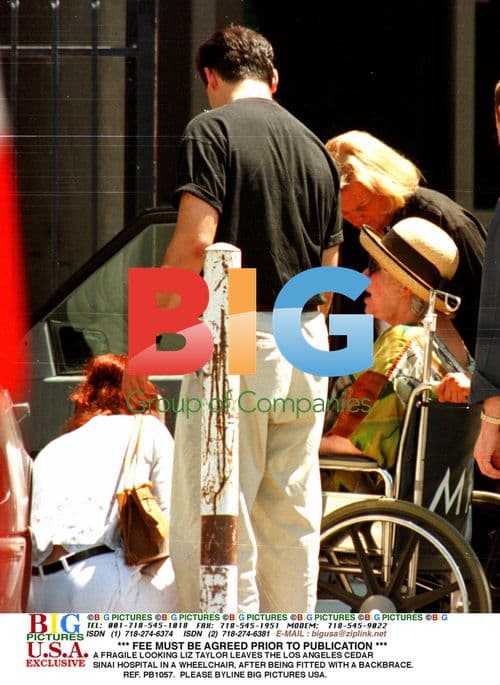 Liz Taylor leaves hospital in wheelchair