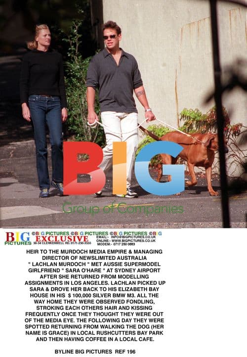 Lachlan Murdoch and Sara O'Hare at Sydney Airport