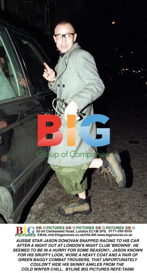 Jason Donovan Rushing to Car
