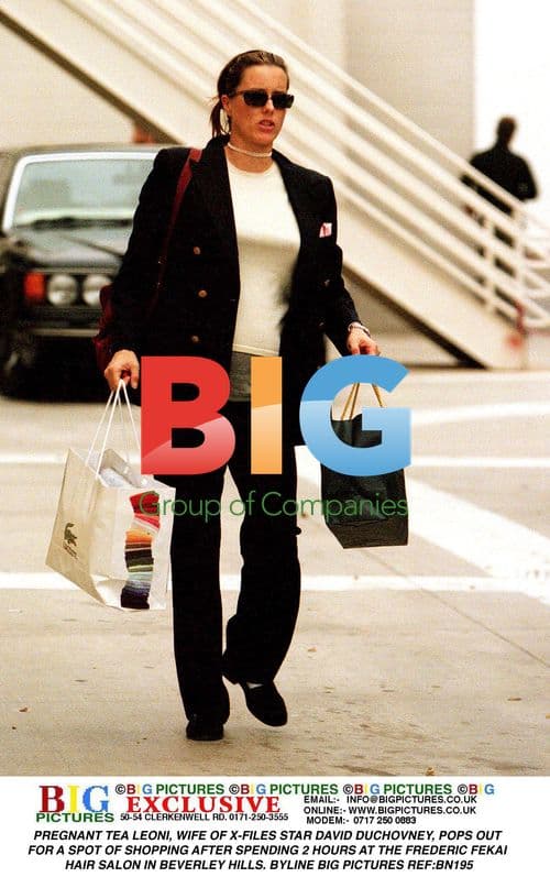 Pregnant Tea Leoni Out Shopping in Beverly Hills