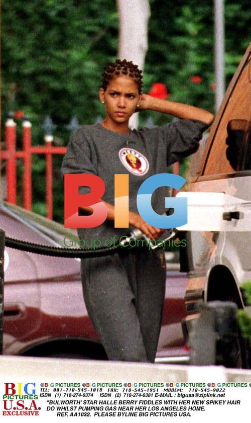 Halle Berry pumping gas with spikey hair