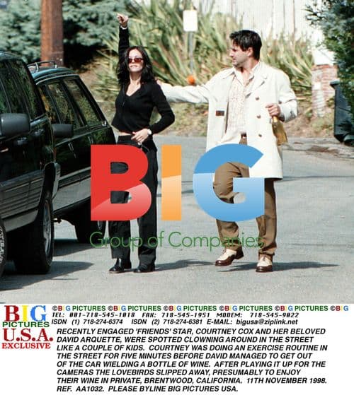Courtney Cox and David Arquette Clowning in Street