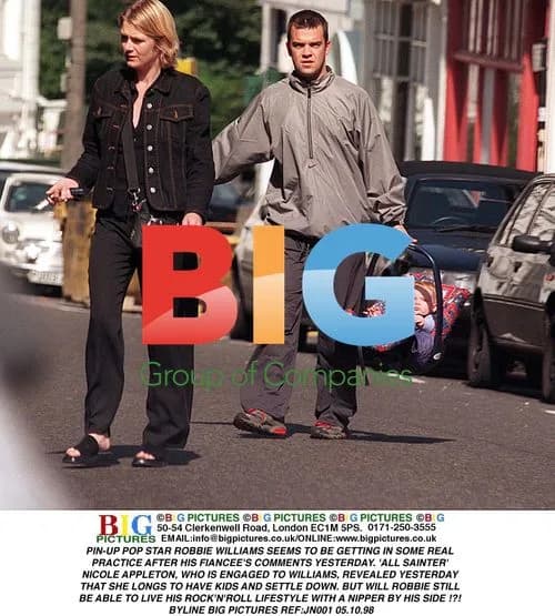 Robbie Williams with Baby Carrier