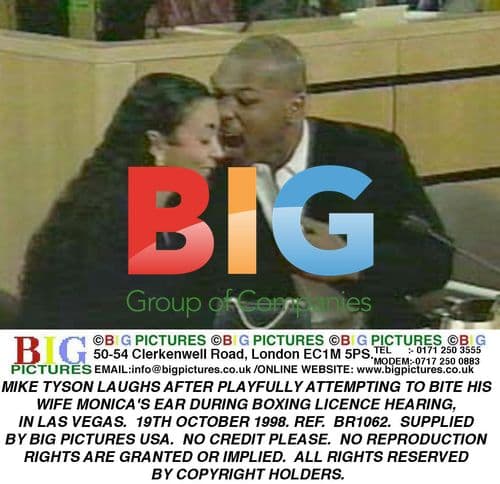 Mike Tyson plays with wife Monica at hearing