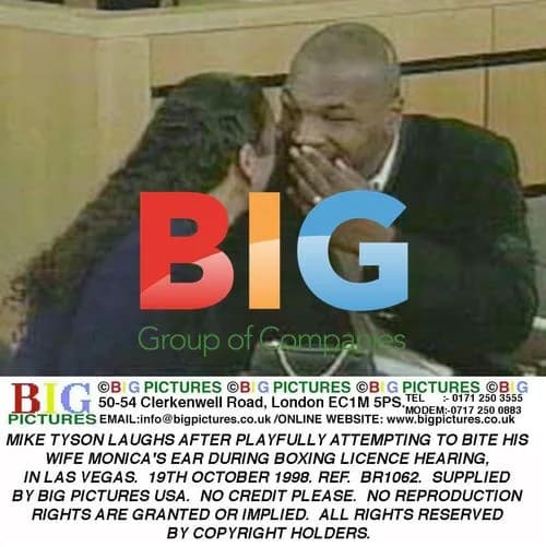 Mike Tyson attempts to playfully bite wife's ear