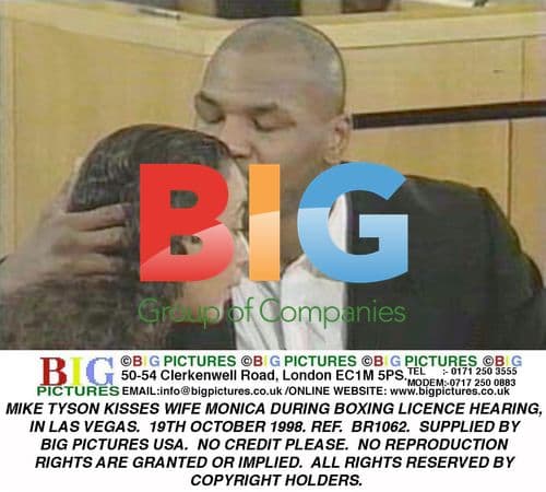 Mike Tyson kisses wife Monica at boxing hearing