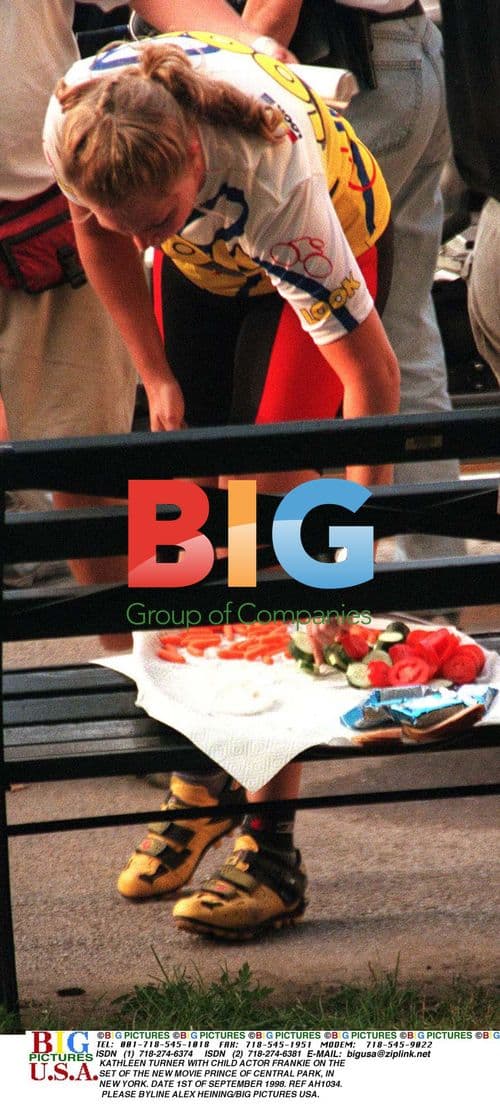 Kathleen Turner and child actor on movie set