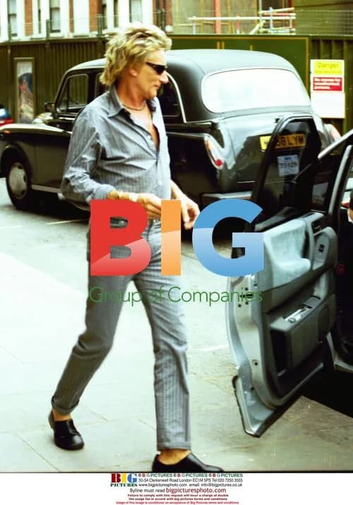 Rod Stewart Exits Car in London