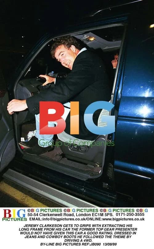 Jeremy Clarkson exits car in cowboy boots