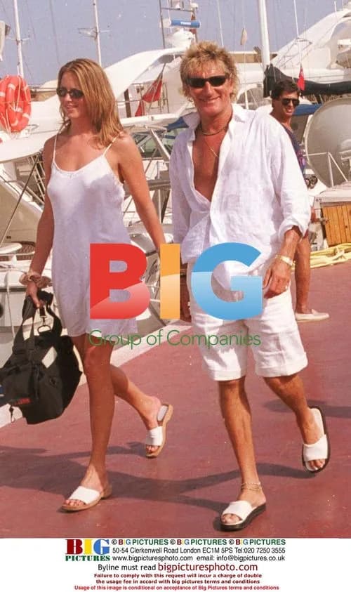 Rod Stewart and friend on pier in Majorca