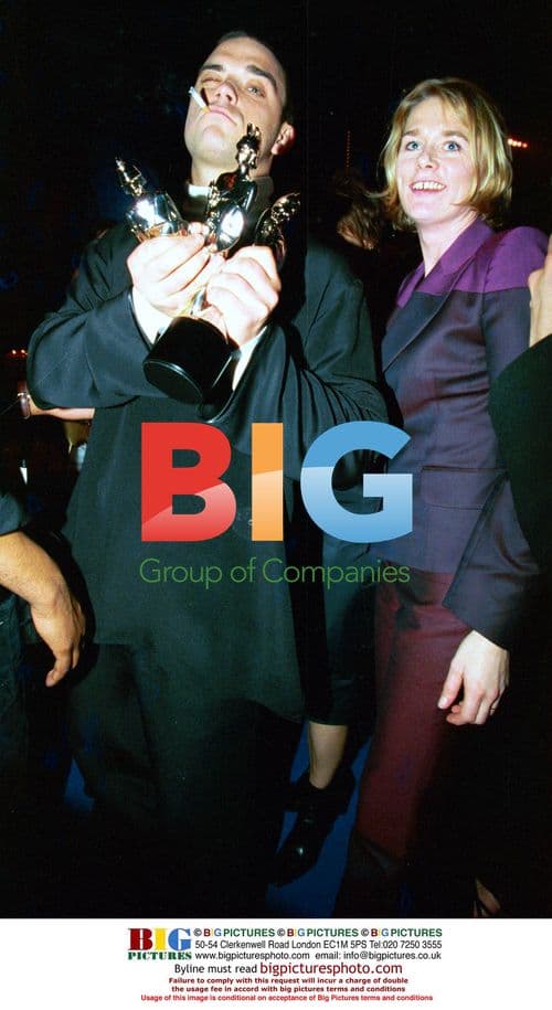 Robbie Williams Celebrates Brit Awards Wins