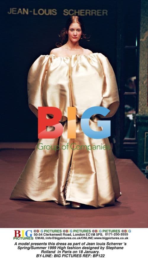 Model in Jean Louis Scherrer gold dress