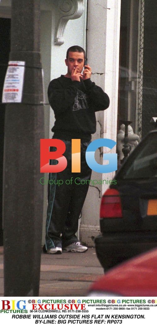 Robbie Williams Steps Out in Kensington