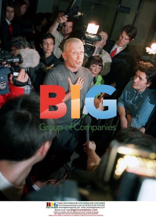 Jean-Paul Gautier Talks with Photographers at Fashion Show