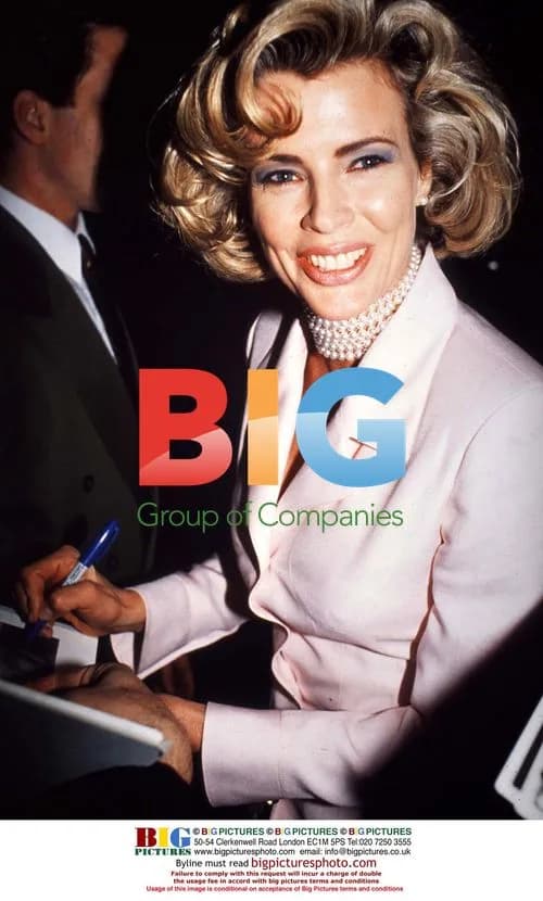 Kim Bassinger posing for photo
