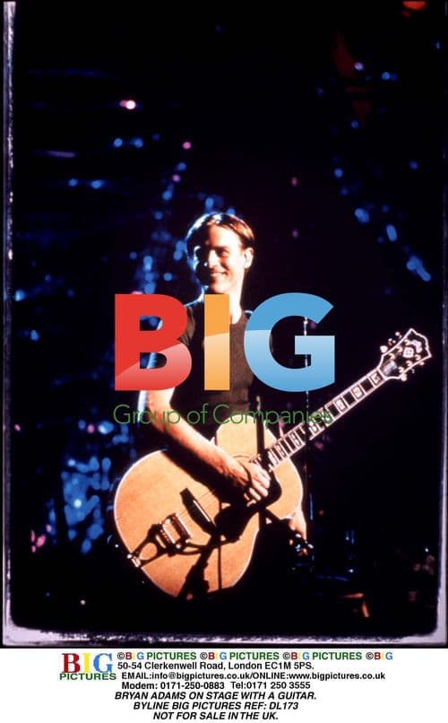 Bryan Adams on Stage with Guitar