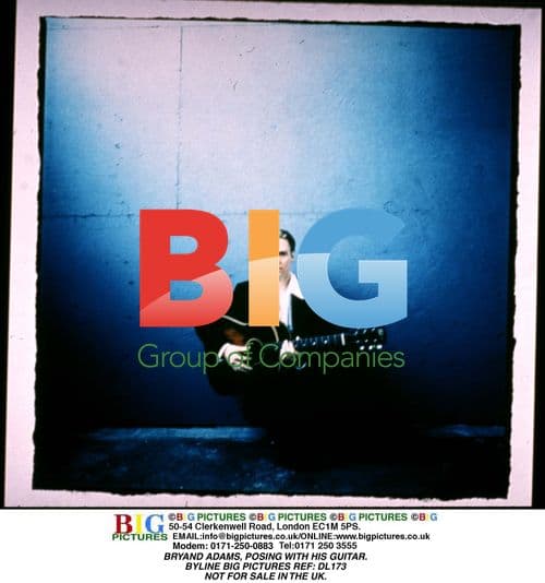 Bryan Adams Posing with Guitar