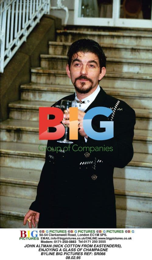 JOHN ALTMAN Enjoying Champagne