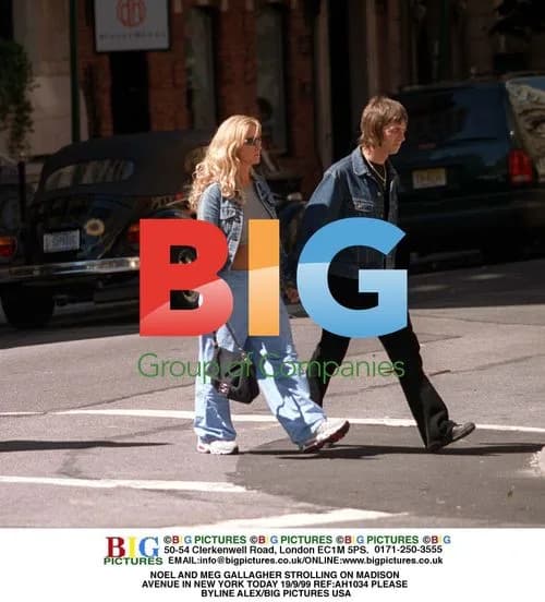 Noel and Meg Gallagher stroll on Madison Avenue
