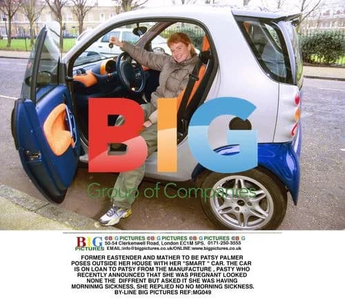 Patsy Palmer Poses with Smart Car