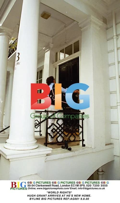 Hugh Grant arrives at new home