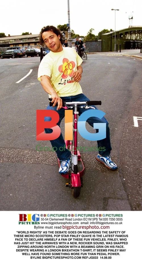 Finley Quaye rides micro scooter in London