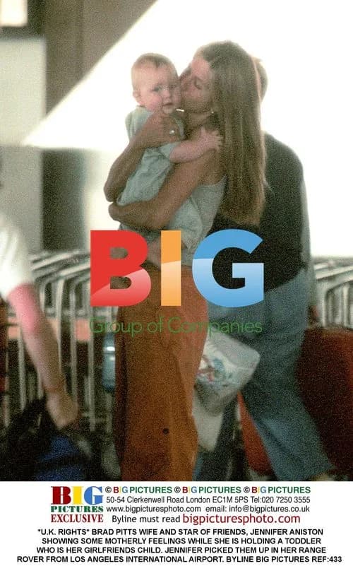Jennifer Aniston Holding Toddler